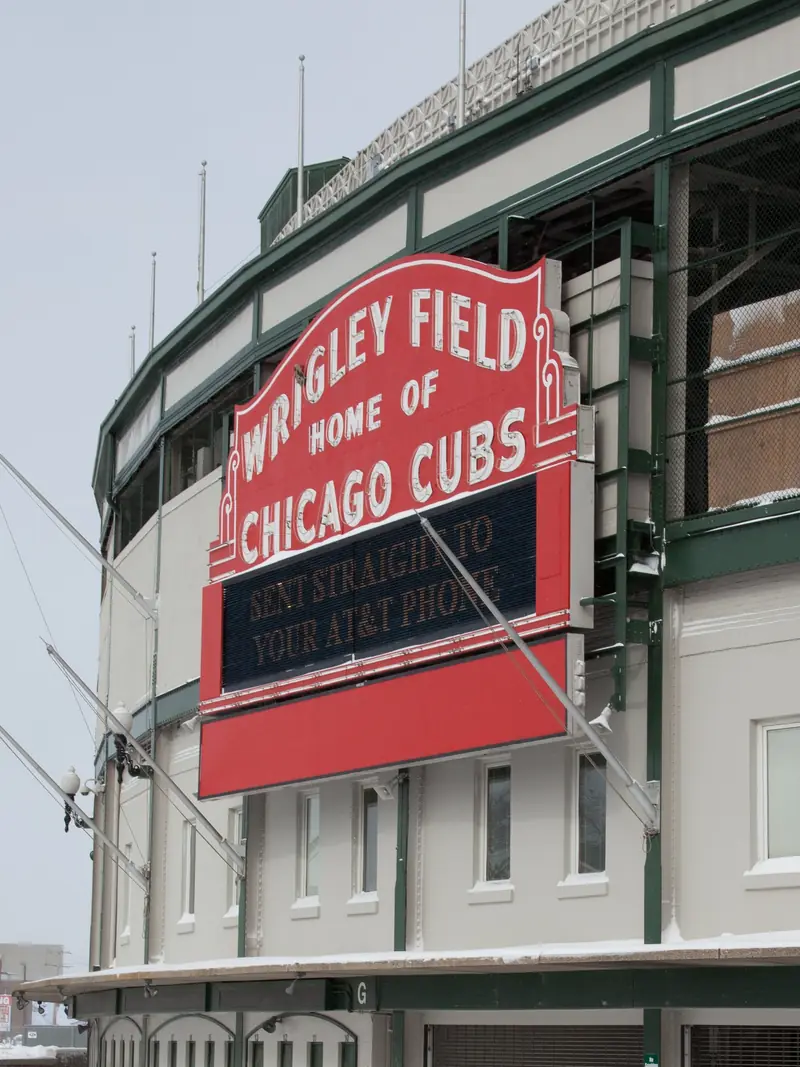 The red Wrigley Field marquee over the main gate in Chicago, snow on the ledges